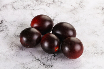 Raw ripe black kumato tomato
