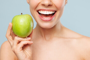 Close up cropped smiling half naked topless young woman 20s with nude make up hold in hand green...