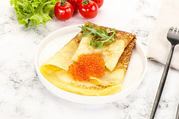 Russian pancake with red caviar