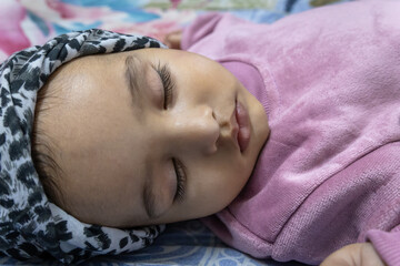 cute toddler innocent sleeping portraits at indoor from flat angle