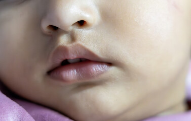 cute toddler lips at indoor from flat angle