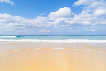 Beach in summer season at Phuket Thailand. Concept Travel and tour background,Empty beach copy space with waves crashing on sand