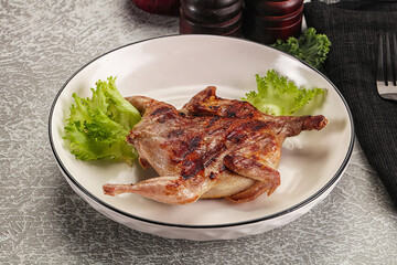 Grilled quail in the plate
