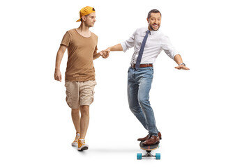 Fototapeta premium Guy helping a man riding a skateboard