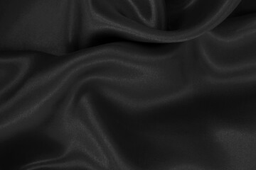 Obraz premium Black fabric cloth texture for background and design art work, beautiful crumpled pattern of silk or linen.