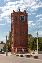 Obraz premium An ancient water tower with a clock in Yelets, Russia