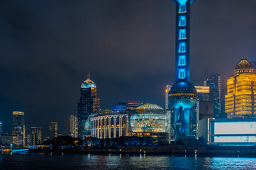 Naklejka premium Urban skyscrapers in Shanghai at night; 