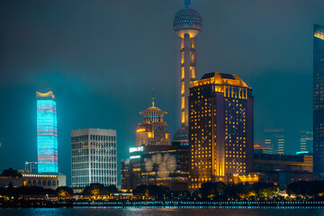Obraz premium Urban skyscrapers in Shanghai at night; 