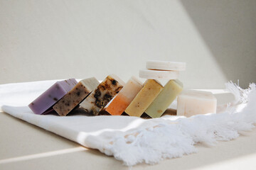 Handmade soap from natural ingredients, various herbs. Concept of sustainable use, bath products. Front view
