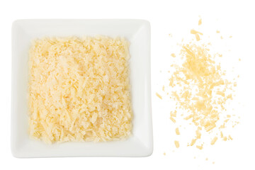 grated parmesan cheese in ceramic bowl isolated on white background. Top view. Flat lay