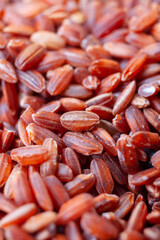 Uncooked, red rice. Food background texture. Top view. Close-up