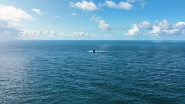 A lighthouse rising out of the ocean. Fastnet lighthouse 4k