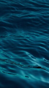3d looping vertical video. Abstract background of wavy water texture. Blue ocean surface live image. Calm sea motion