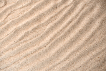 Sand waves texture background. Sand on beach as background. top view