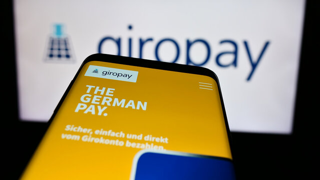 Stuttgart, Germany - 07-04-2024: Mobile phone with website of German payments company Giropay (Paydirekt GmbH) in front of business logo. Focus on top-left of phone display.