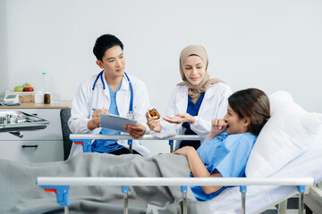 Doctors providing attentive care to a patient in a hospital bed. Compassion, professionalism, and expert healthcare. Ideal for medical