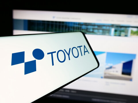 Stuttgart, Germany - 07-05-2024: Cellphone with logo of Japanese machinery company Toyota Industries Corporation in front of website. Focus on center-left of phone display.