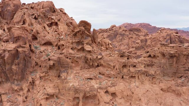 Aztec Sandstone revealing the texture and holes with the valley of fire in the background