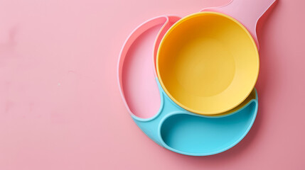 A top view of children's tableware including a silicone bib and a bowl, ideal for serving baby food and other kid-friendly dishes.