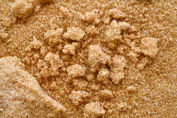 Clumped brown sugar texture background. Cooking preparation concept.