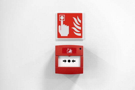 Fire alarm button in the building, Red fire alarm button on wall. Emergency button in red box to use in case of fire.
