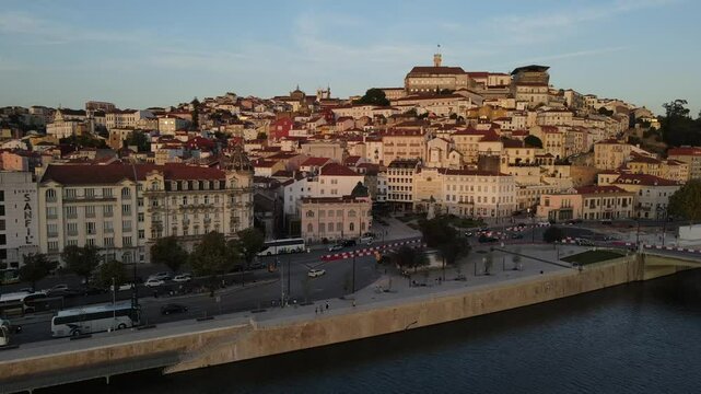 Aerial video of the Mondego River in front of downtown Coimbra, Europe, Portugal