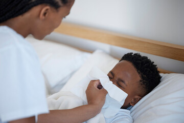 Mom, boy and sick with blowing nose in bedroom with support, love and care with tissue for sinus. Black family, parent and kid at home with worry or stress for illness, flu and infection or virus