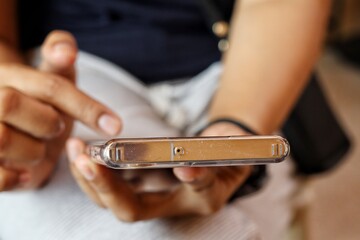 Woman using smart phone on hand