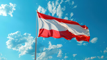 The red-white-red flag of Austria is flying in the blue sky. The Austrian flag is fluttering in the wind against a background of small white clouds. Immigration. A national holiday