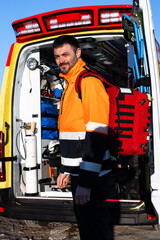 Paramedic standing outside the ambulance.