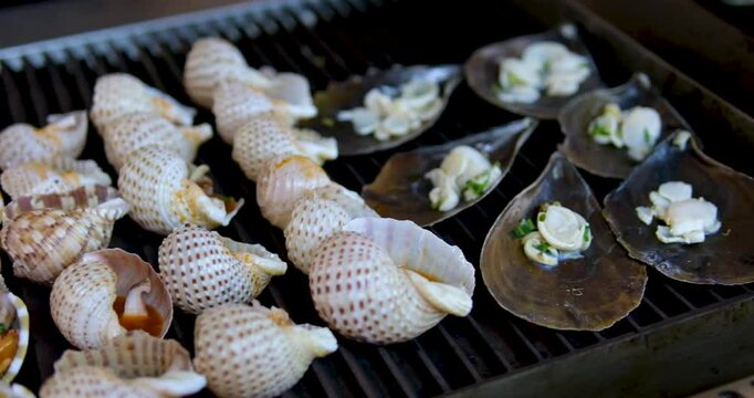 food shellfish. Mussels in a bowl with herbs, rotating on a turntable. Shellfish, seafood close-up
