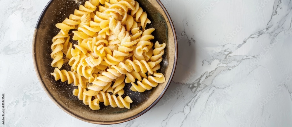 Poster top view of homemade ptitim pasta in a bowl on a light background with ample copy space image
