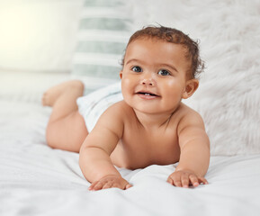 Child development, cute and innocent with baby on bed in home for growth, having fun or playing....