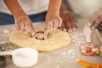 Hands, child and cookie cutter in kitchen for baking, together and dessert for nutrition. Food, parent and flour for cooking and party or birthday with ingredients in home for recipe, sweets or snack