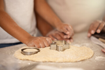 Hands, flour and cookie cutter in kitchen for baking, together and dessert for nutrition. Food, chef and friends for cooking and party or birthday with wellness and recipe in home for sweets or snack