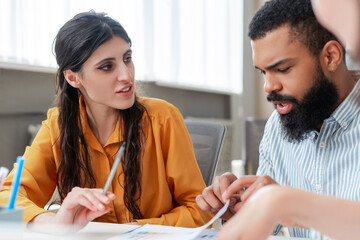 Business team analyzing financial data and developing growth strategies