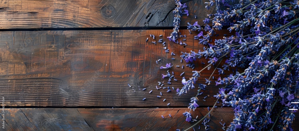 Poster Top view of a lovely display with preserved lavender flowers on wooden table ideal for adding text in the copy space image