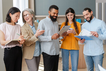 Group of business people having meeting using digital tablet in office