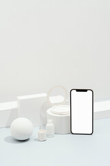 Smartphone mockup with white cosmetics, makeup product templates