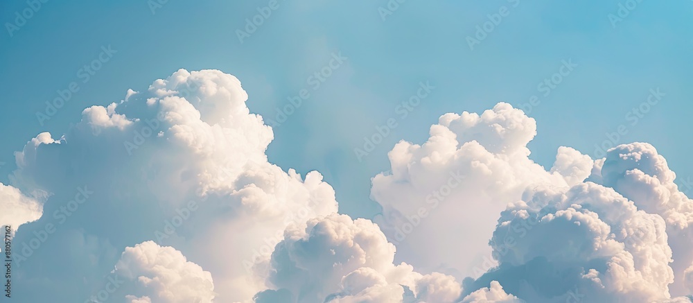 Poster a serene scene of puffy white clouds set against a clear blue sky in summer with room for a copy spa