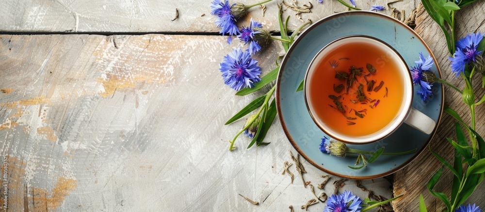 Aufkleber notebook featuring a delightful arrangement of fragrant green tea leaves and vibrant cornflowers on 