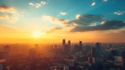 Fototapeta premium Sunset view of city skyline tall buildings clouds blue sky background Panoramic aerial landscape washed out color grading in golden hour lighting