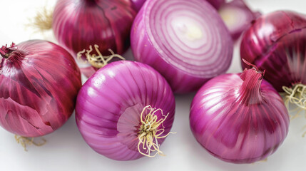 Fresh red onions whole and sliced on white background