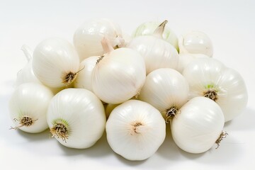 A pile of fresh white pearl onions on a white surface