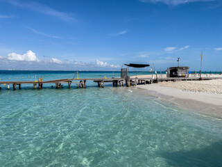 Caribbean beach pier in Isla Mujeres, Mexico. Sand beach.