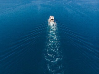 Top above aerial drone view luxury motor yacht sailing in turquoise blue sea water Mediterranean...