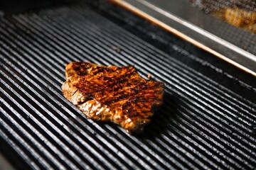 Grilled Steak on Black Grill
