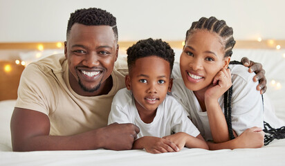 Black family, portrait and happy kid with parents in bedroom to relax in home. Face, mother and father with boy child in bed for support, connection and bonding together for healthy relationship