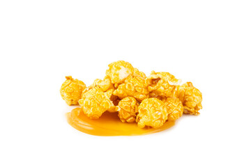 Sweet caramel popcorn isolated on white background. Salted caramel popcorn. Caramel sauce. Close up. Topping.