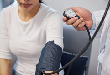 Blood pressure, hands of doctor or woman for health, diagnosis or hypertension symptoms in clinic,...